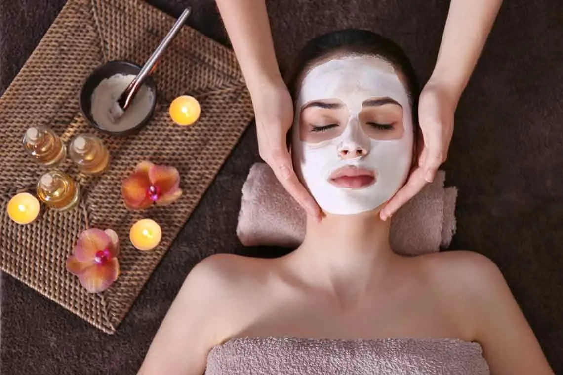 Client relaxing during a facial skincare treatment at HUTU SPA Nha Trang